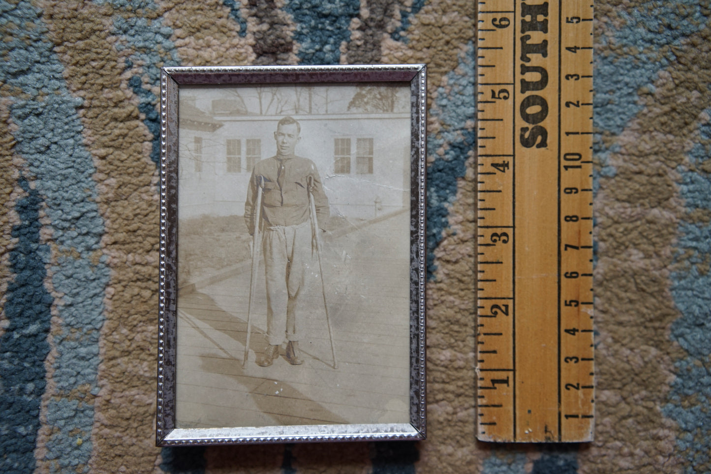 antique portrait of man on crutches