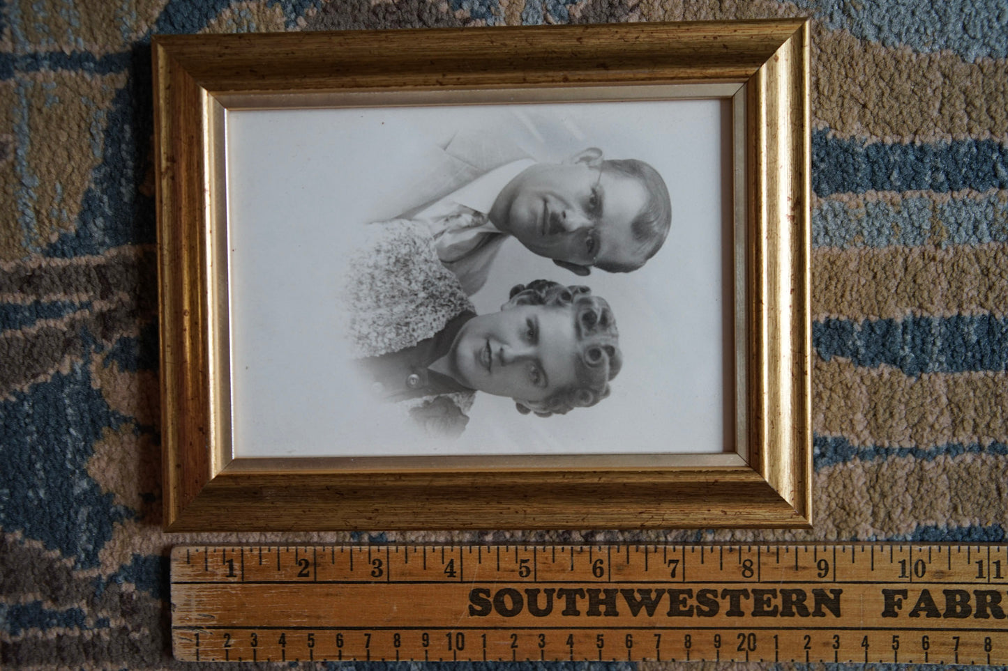 antique white vignetted portrait photo in gold frame