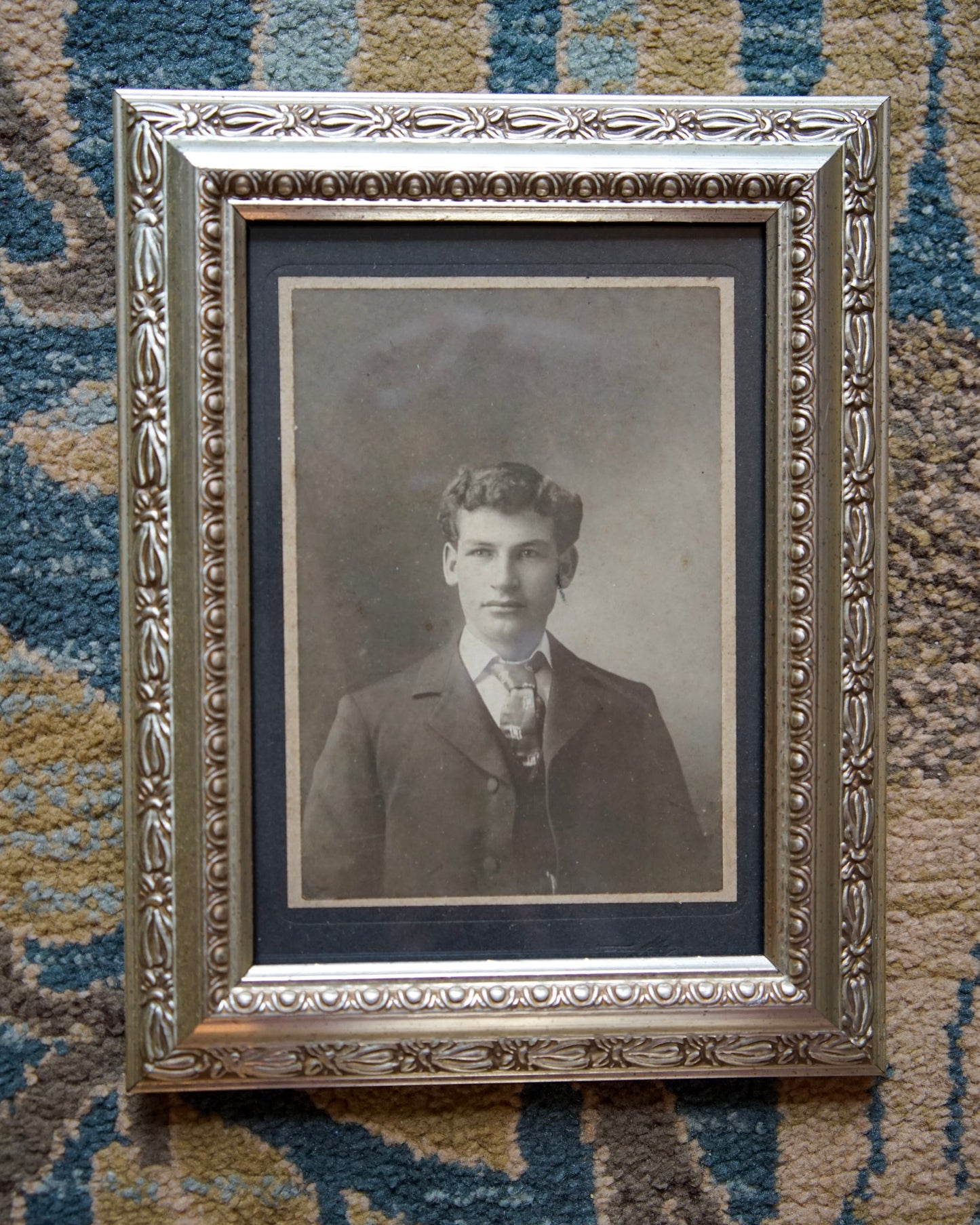 antique portrait photo in ornate frame