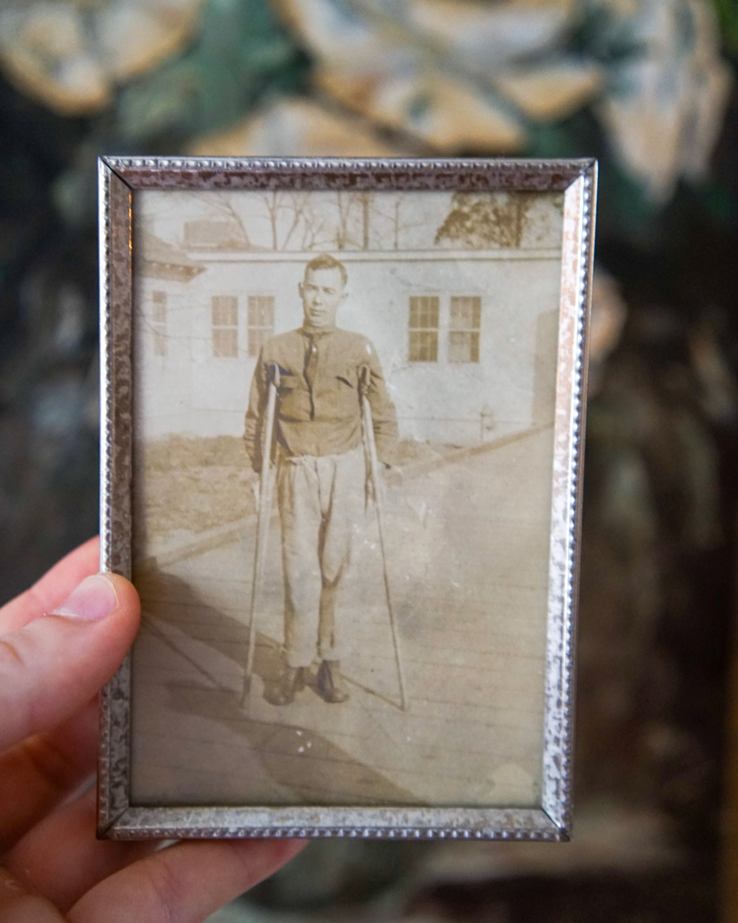 antique portrait of man on crutches