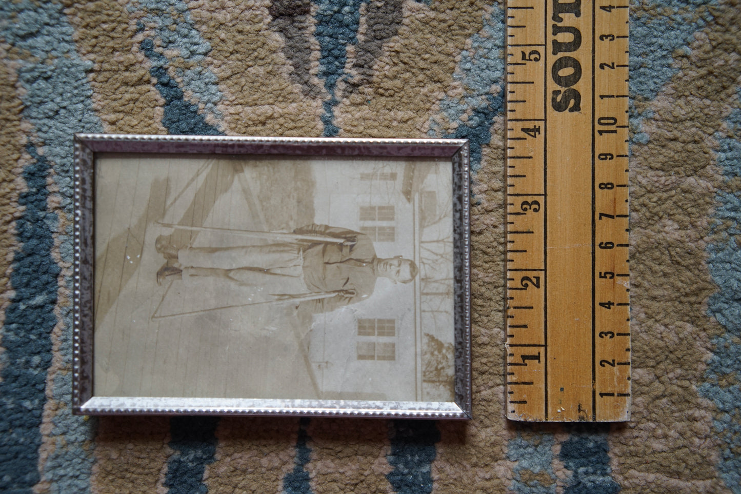 antique portrait of man on crutches