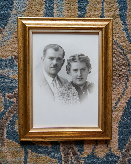 antique white vignetted portrait photo in gold frame