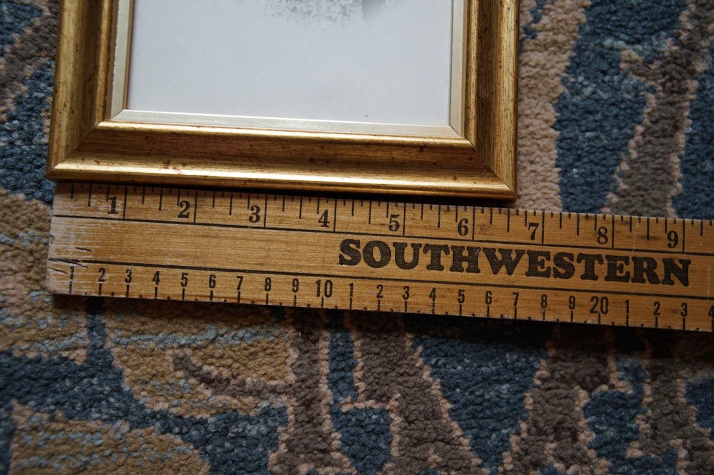 antique white vignetted portrait photo in gold frame