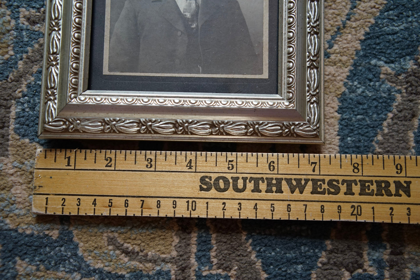 antique portrait photo in ornate frame